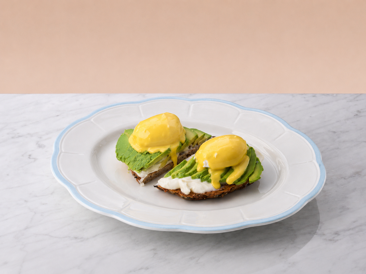 Avocado toast with eggs and hollandaise sauce
