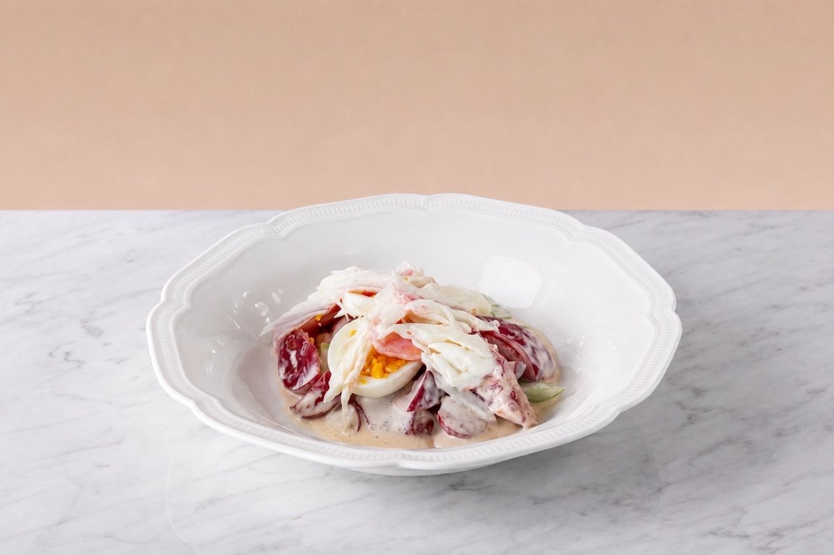 King crab salad with tomato and sour cream
