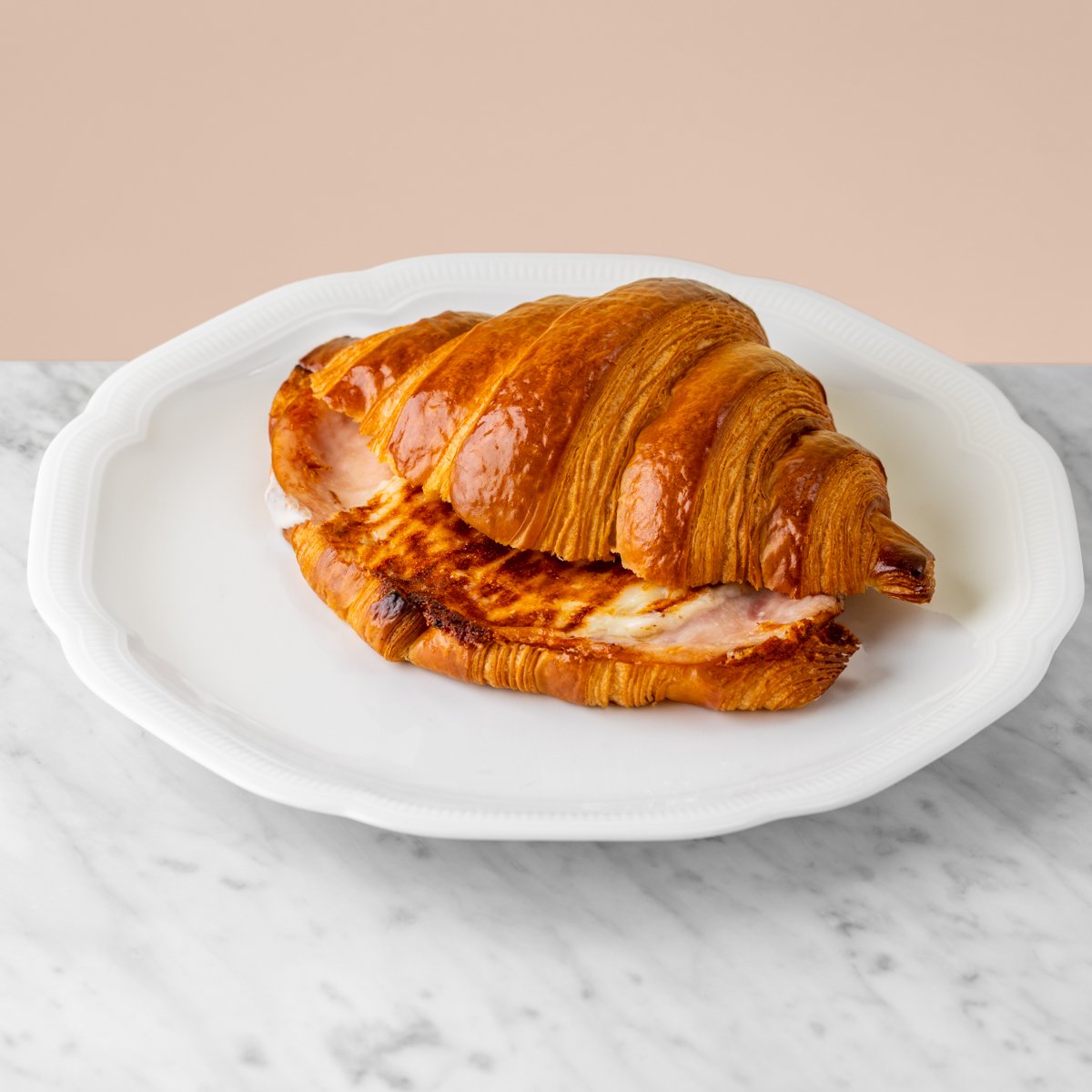 Grilled croissant with turkey and mozzarella